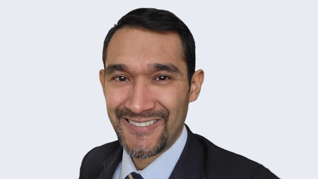Metanalysis Chief Technology Officer Carlos Diaz, posing and smiling